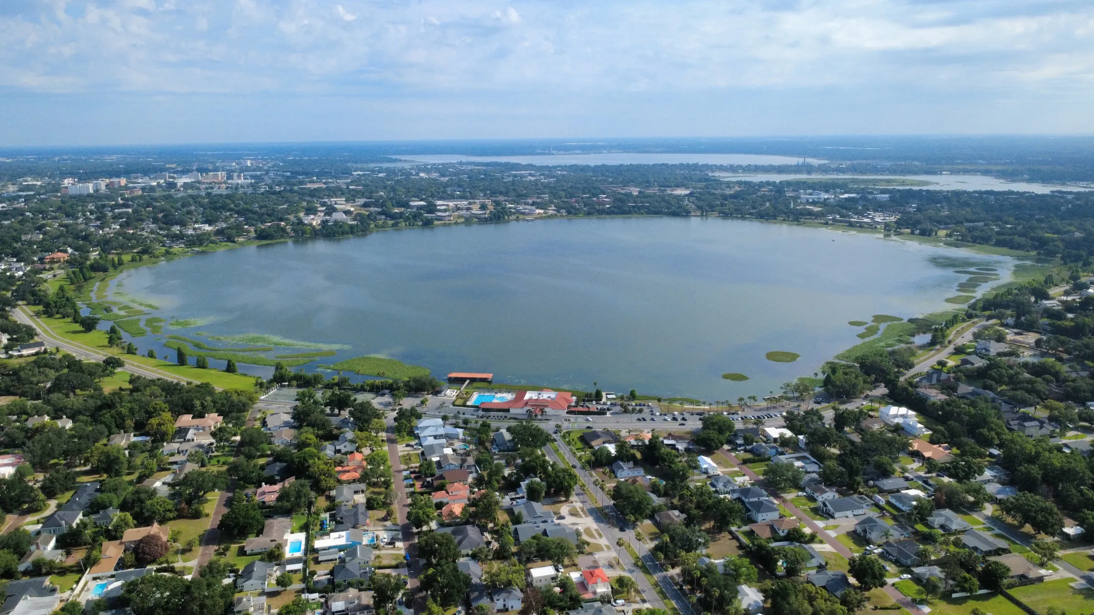 Aerial view of Lake Hollingsworth in Lakeland, ringed by neighborhoods and oak trees